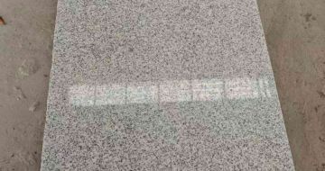 乐山芝麻白光面毛板